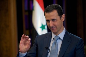 A handout picture dated February 8, 2015, and released by the Syrian Arab News Agency (SANA) on February 10, 2015 shows Syrian President Bashar al-Assad (R) giving an interview to the BBC's Middle East Editor in Damascus. Assad said in an interview published on Tuesday, that Damascus receives "information" about air strikes by the US-led coalition against the Islamic State group in Syria. AFP PHOTO/HO/SANA  == RESTRICTED TO EDITORIAL USE - MANDATORY CREDIT "AFP PHOTO / HO / SANA" - NO MARKETING NO ADVERTISING CAMPAIGNS - DISTRIBUTED AS A SERVICE TO CLIENTS ==